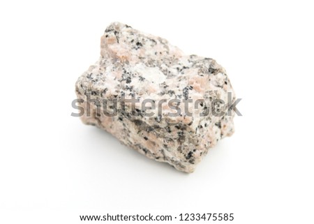 close up of granite rock isolated over white background Royalty-Free Stock Photo #1233475585