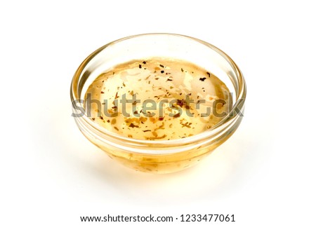 Salad dressing or Homemade sauce, isolated on a white background. Close-up Royalty-Free Stock Photo #1233477061