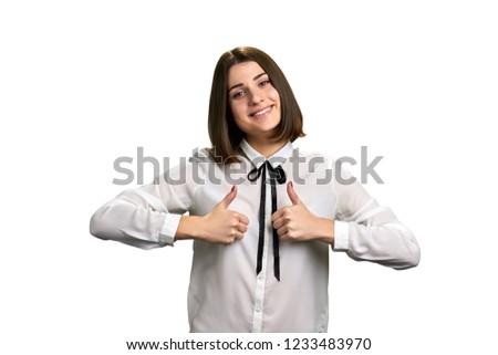 Female corporate with two thumbs up. Female office worker giving thumbs up with two hands over white background.