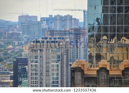 Construction cranes fill the Houston skyline.