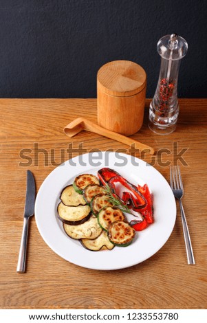 Stock Photo - Roasted or fried vegetables on a white plate.
