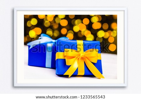 Gift boxes on blurred background. Colored presents wrapped with paper, bow and ribbons. Christmas or birthday packages. Celebration design. Wall frame poster with gift present box photo