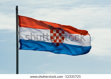 croatian flag on the wind over cloudy sky