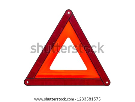 Foldaway, reflective road hazard warning triangle isolated on a white background with a clipping path. Royalty-Free Stock Photo #1233581575