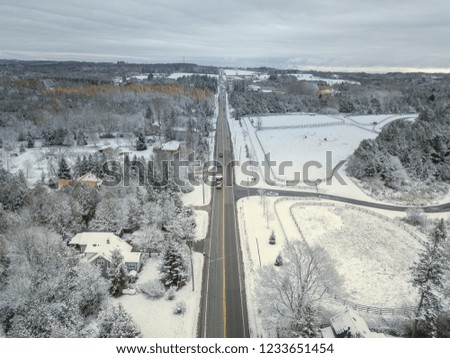 Country road Snowy and frozen winter landscapes. Aerial view. Drone 