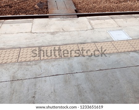  train station's platform edge. Royalty-Free Stock Photo #1233651619