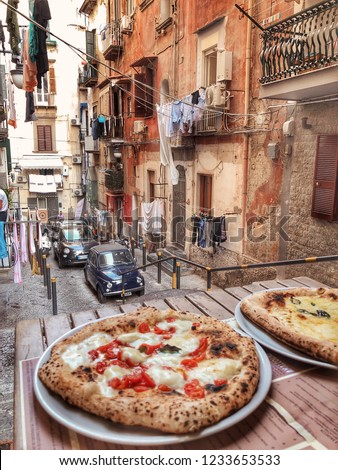 Small Authentic Neapolitan Street and Pizza in Italian Trattoria Royalty-Free Stock Photo #1233653533