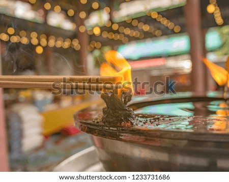 Close up burning joss stick in Temple