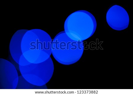 Defocused lights blue abstract background. Natural photo bokeh patten.