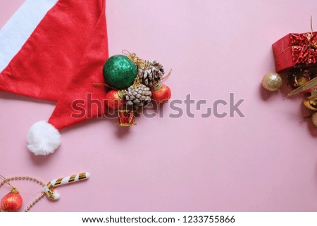 Christmas and New Year holiday background with copy space, creative idea border design with gift boxes, red pine and hat christmas.