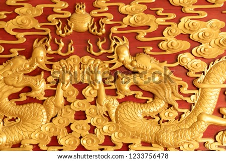Decorated with golden dragon at the bottom of red.
