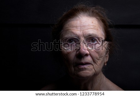 Portrait of an elderly woman with glasses