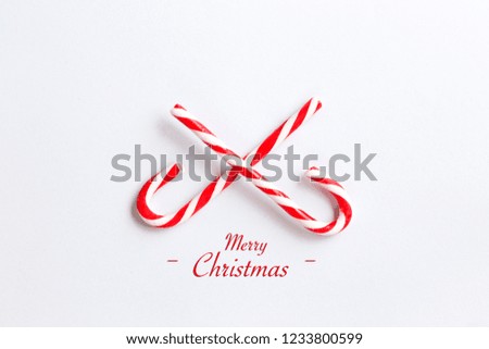 Merry Christmas greeting colourful.Merry Christmas Candy Canes on white background