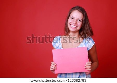 Smiley face of casual woman with red blank