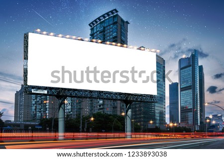Billboard clear mock up in night streets of city useful for design Royalty-Free Stock Photo #1233893038