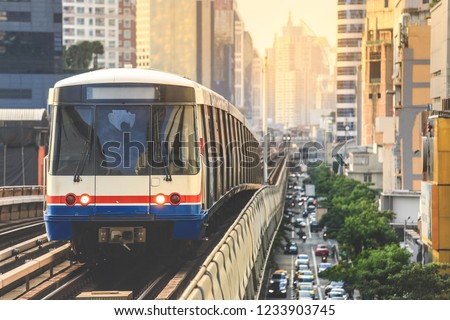 BTS Sky Train is running in downtown of Bangkok.  Sky train is fastest transport mode in Bangkok Royalty-Free Stock Photo #1233903745