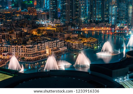 Unique view of Dubai Dancing Fountain show at night. Tourist attraction. Luxury travel destination.  Royalty-Free Stock Photo #1233916336