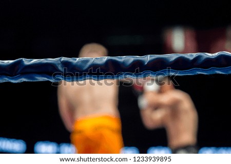 Boxing ring ropes on fight blur background