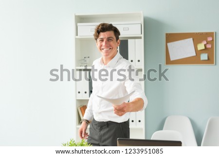 Business people, fool and joke concept - young handsome man in the office