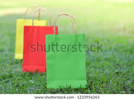 bag shopping / paper shopping bags colorful on green field - colorful of three
bag shopping outdoors