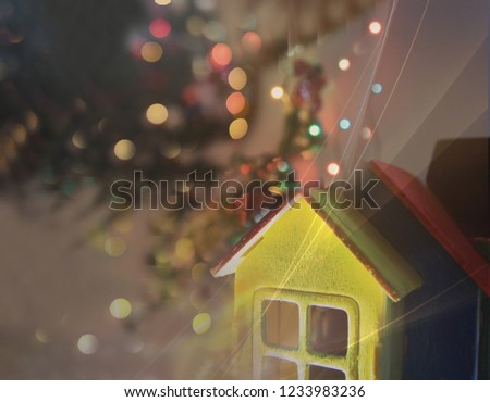 A toy house or Merry Christmas and Happy New Year. Magic, fairy tale, family, mystery, wonders, make a wish, holiday, festive mood, cozy, home, comfort, holidays at home. Christmas postcard. Be happy.