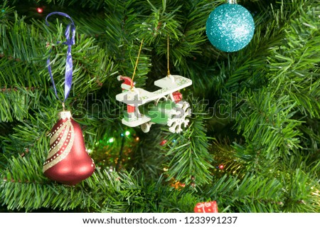 Wooden plane toy on the Christmas tree