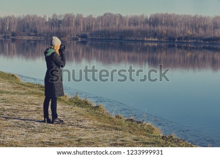 girl taking pictures of beautiful nature