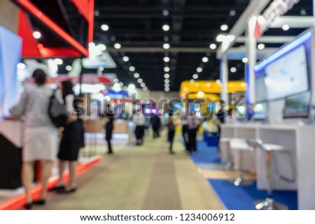 Abstract blurred photo of financial exhibition event in conference hall background, business trade and stock market exchange concept