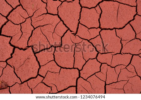 Cracked clay soil Texture, background, seamless pattern. Crack in the ground. Texture, background, seamless pattern. This is useful for designers. a crack in the ground, drought, sun. absence of water