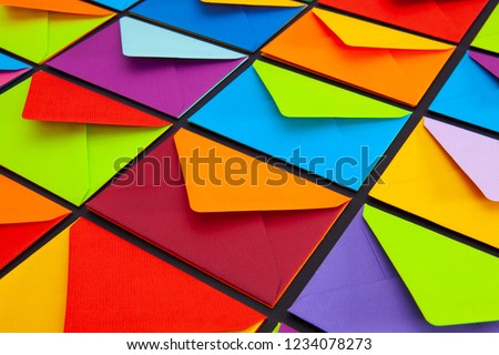 Composition with white and colored envelopes on the table. The photo suitable for various holidays and anniversaries.