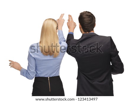 picture of man and woman working with something imaginary.