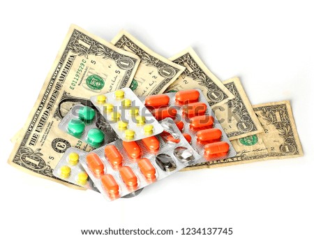 tablets and pills are on American paper dollars as a symbol of paid medicine