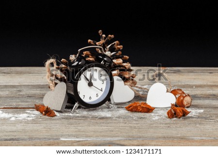Composition with retro alarm clock and Christmas decoration