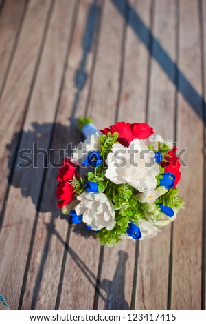beautiful bridal bouquet lays on deck