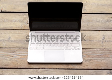 Top view of modern  laptop on wooden desk