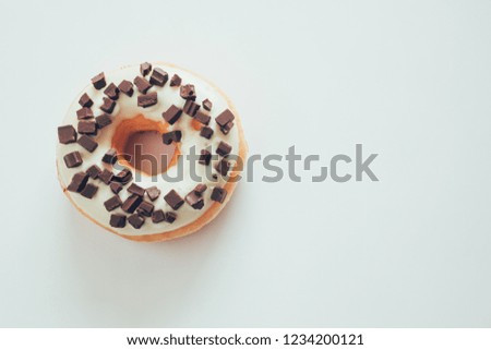 Doughnut white chocolate and topping with dark chocolate.