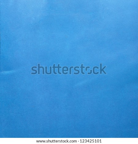 Closeup of detailed blue leather texture background.
