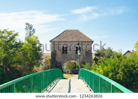 An old bridge connecting the medieval fortress of Bac, Serbia, and the modern district of town