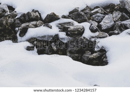 Stones covered by snow