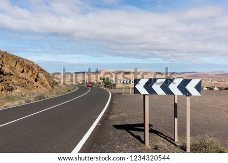 Rocky hill landscape with curved road in Fuerteventura. Canary Islands, Spain