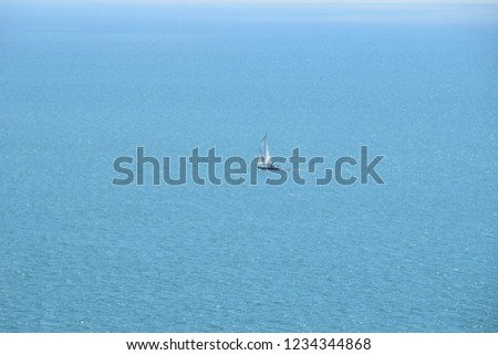 Photo of boat in the sea - filmed from the cliff