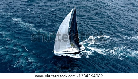 Sailing yacht under full sail at the regatta Royalty-Free Stock Photo #1234364062
