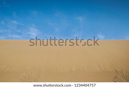 Low Angle View Of Sand Against Sky On Sunny Day
