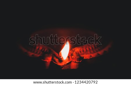 Minimal image of the holy lamp called diya which is an significance of Indian festival Diwali