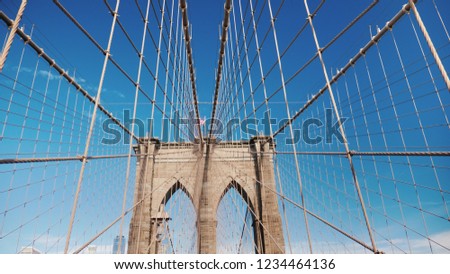 Walk along the Brooklyn Bridge towards Manhattan. One of the most popular tourist places