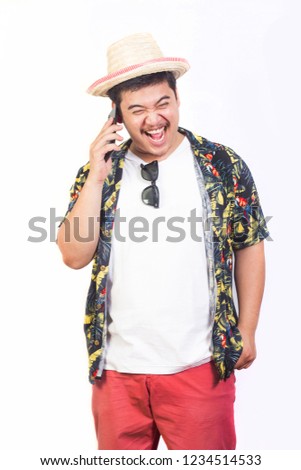 Good mood young man in hawaiian costume talking on the phone received travel isolated on white background.