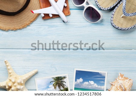 Travel vacation background concept with sunglasses, hat, passport, airplane toy and weekend photos on wooden backdrop. Top view with copy space. Flat lay. All photos taken by me