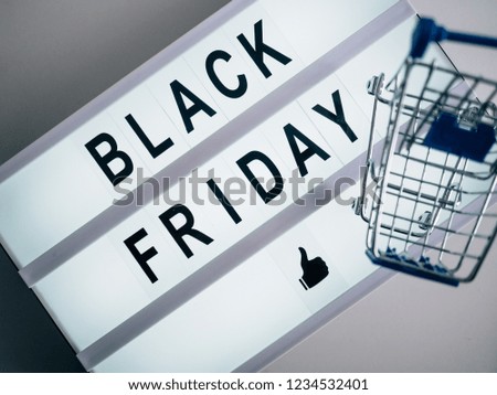 Bright poster with the words Black Friday with an empty shopping cart.