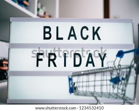 Bright poster with the words Black Friday with an empty shopping cart.