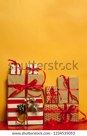 
Christmas gifts on a yellow-red background